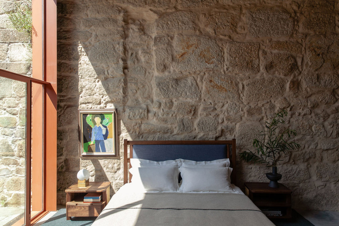 TWENTY-FIVE UPHOLSTERED BED